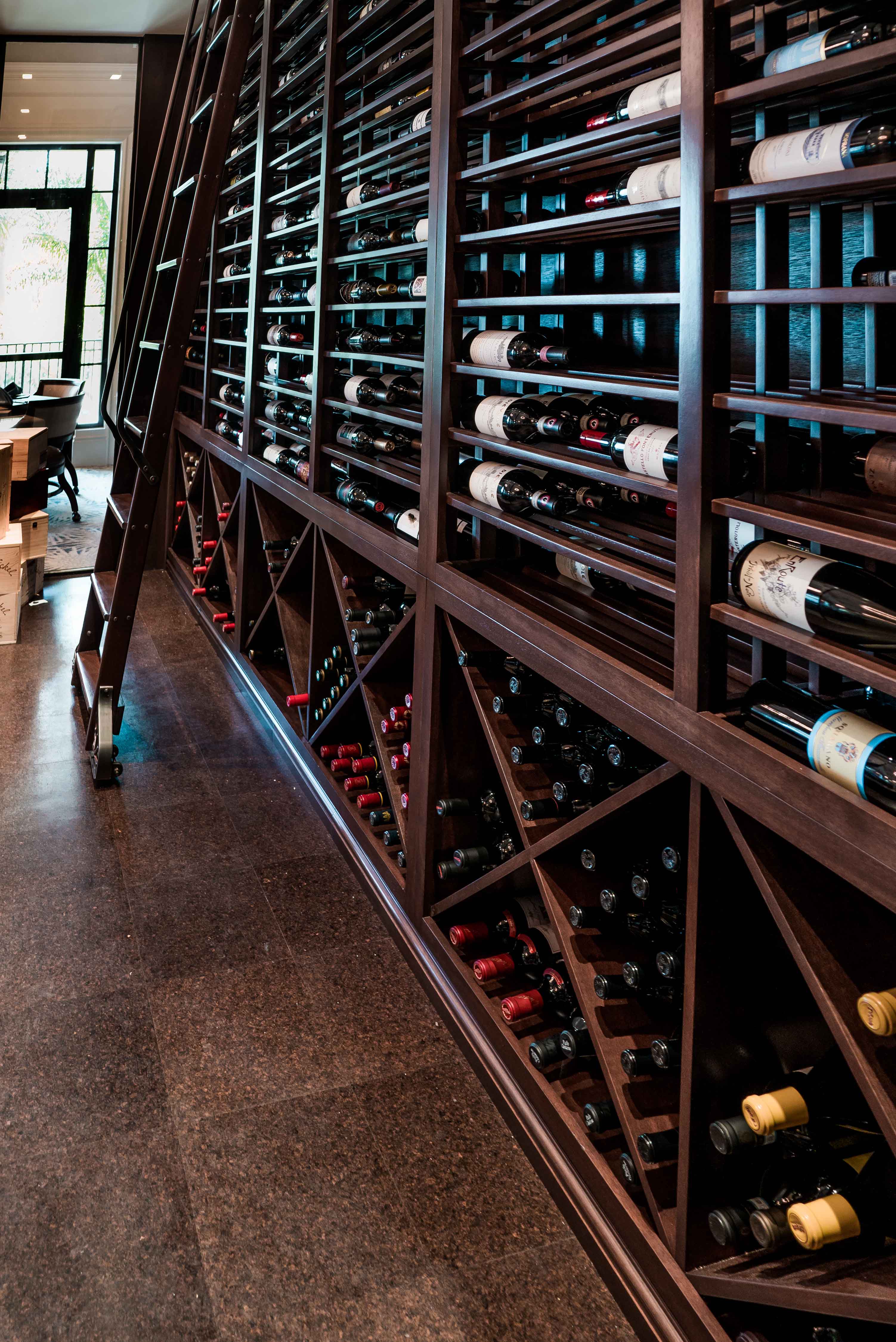 wine collection of Frenchman's Creek Beach & Country Club in Palm Beach Gardens Florida with cubbies designed by j banks design group