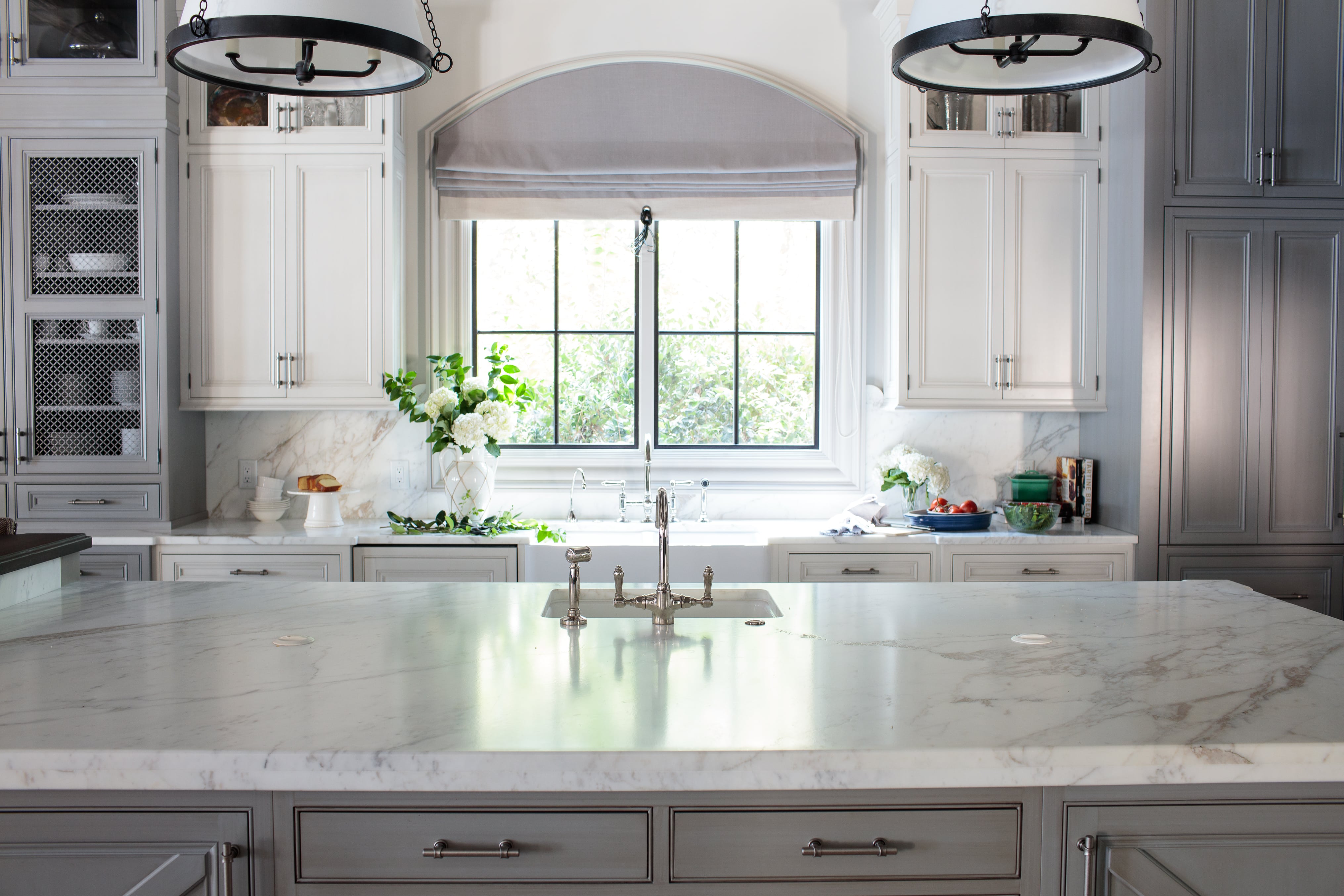 hilton head kitchen by j banks design group with surfaces clad in luxury materials and classic cabinetry