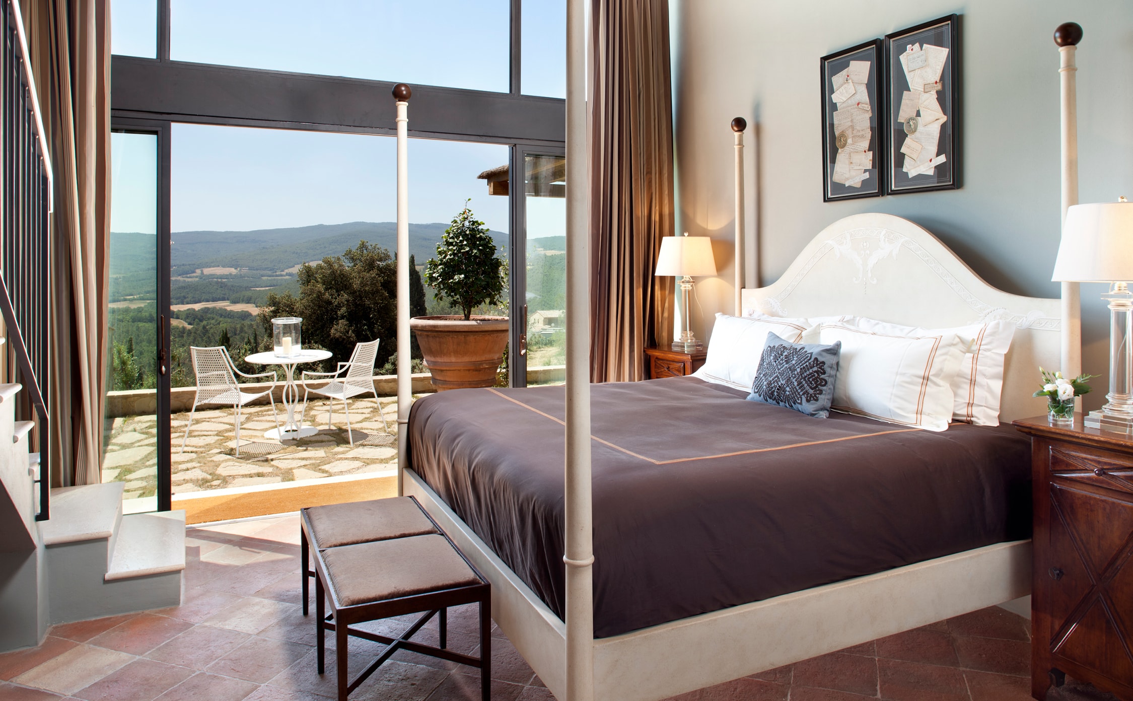 a cosmopolitan italian bedroom in the hotel castello di casole in italy by jbanks design group