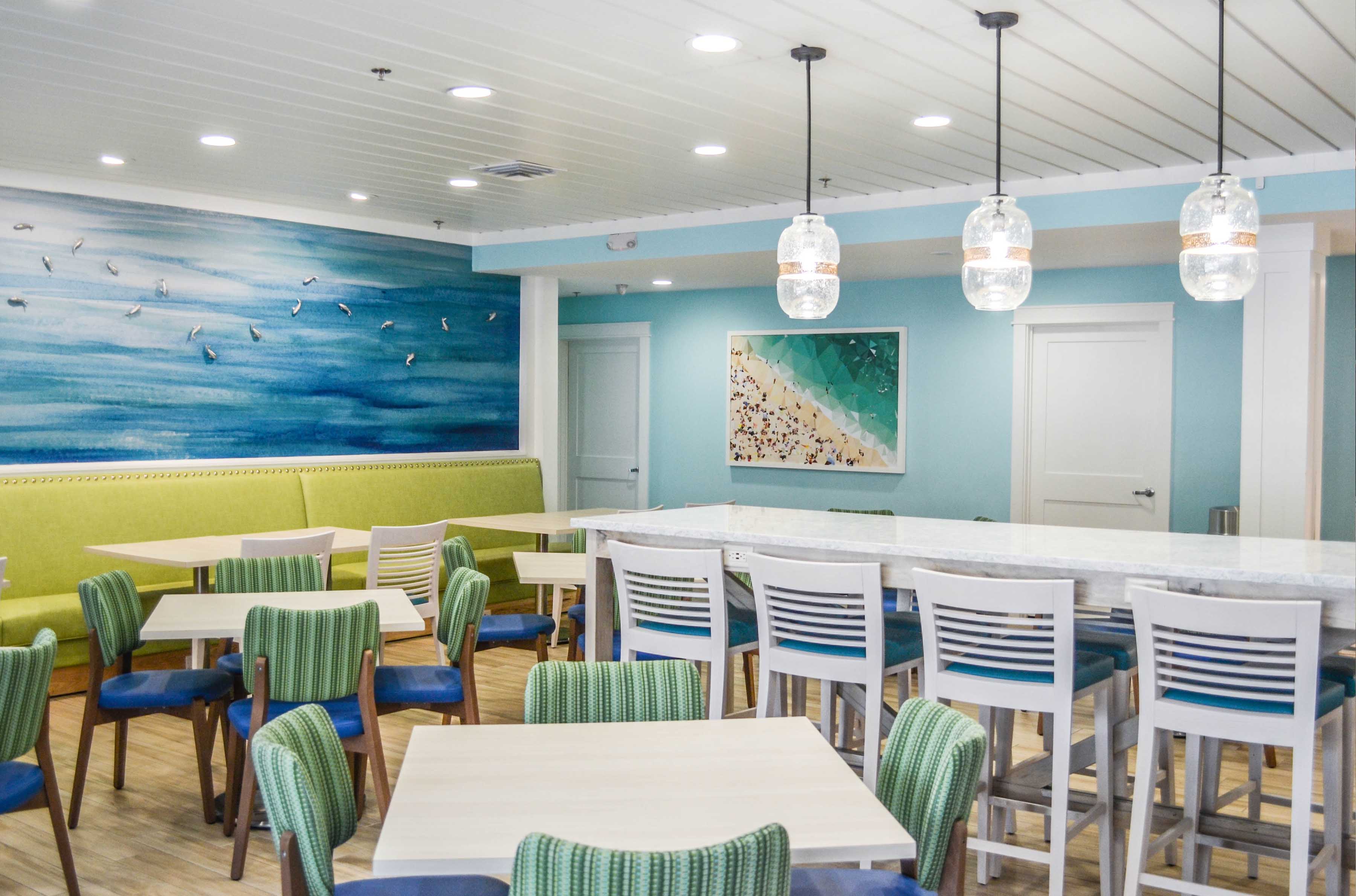 hotel interior design firm j banks design group created this colorful hotel dining area