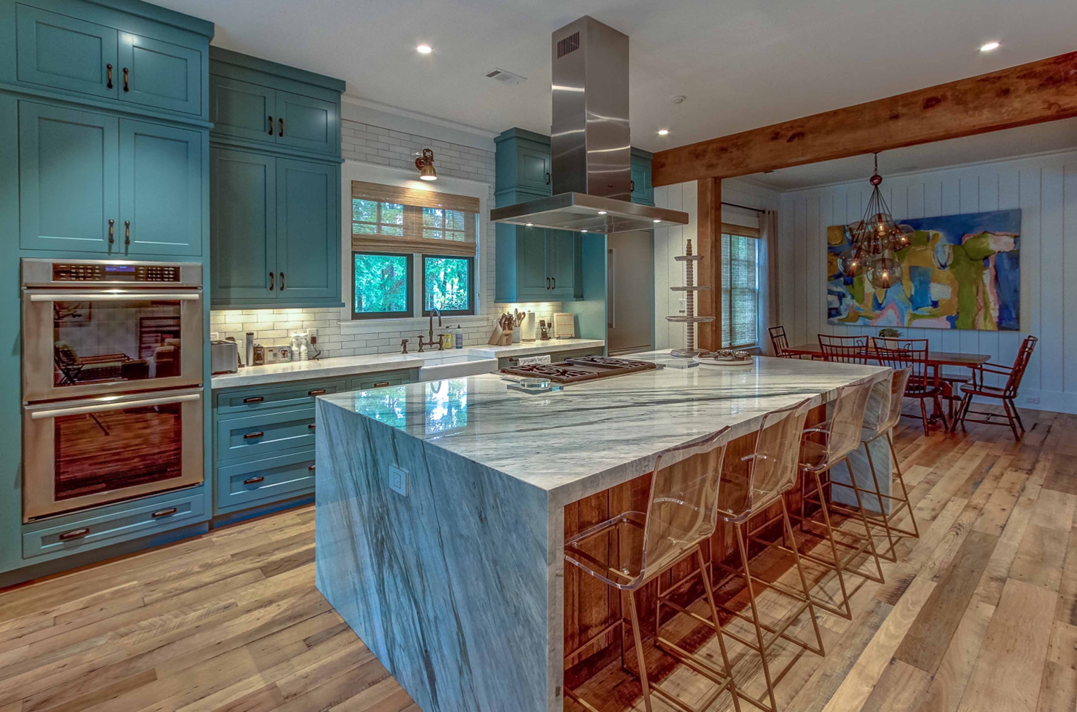 palmetto bluff home by Lisa Whitley for J Banks Design packed with personality thanks to the color of the cabinetry and striated stone