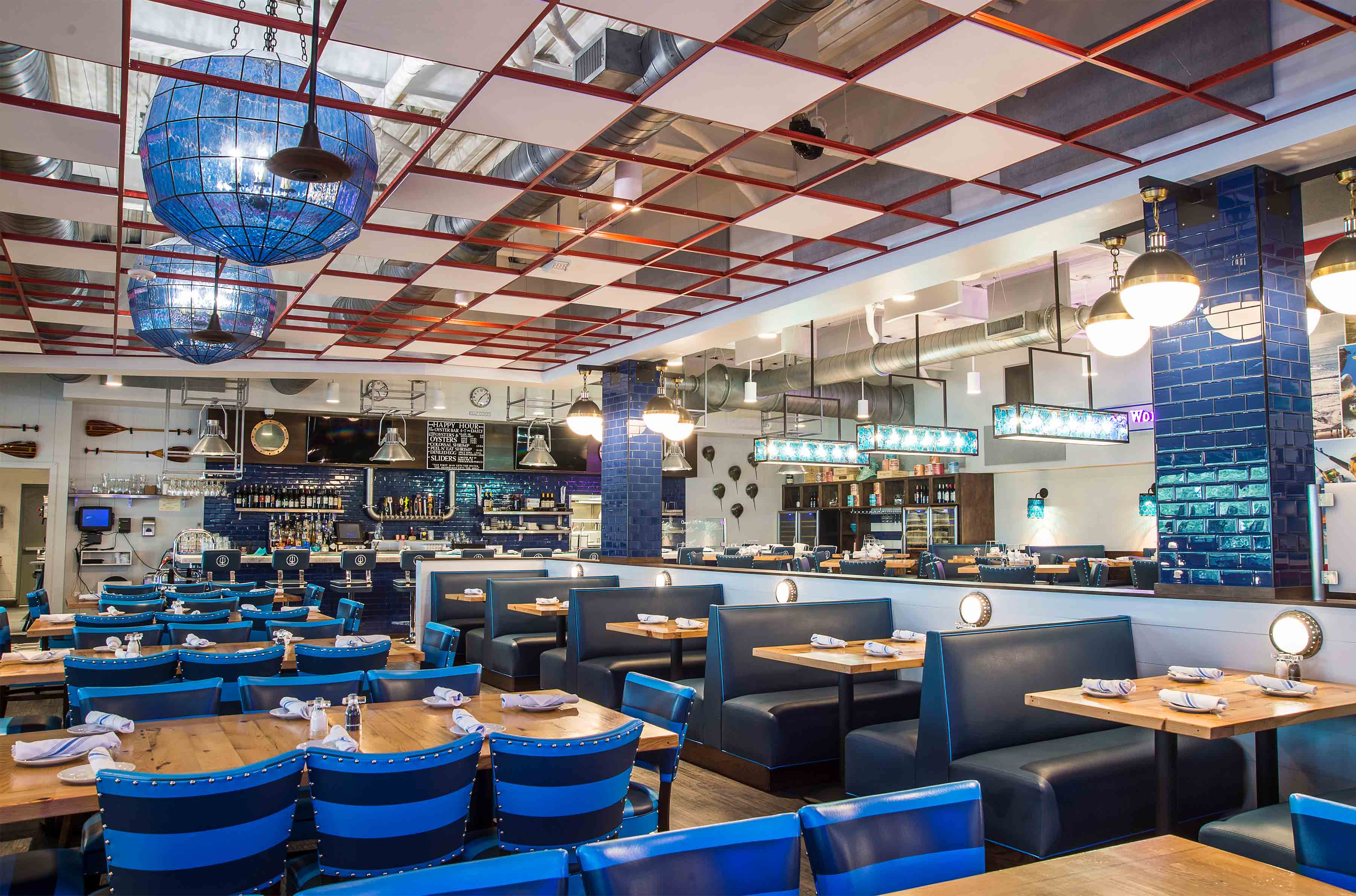 poseidon hilton head restaurant takes on a watery personality with pops of bright turquoise and brilliant blues