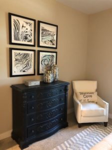 seating vignette at shelter cove featuring elemental colors and sophisticated art by j banks design group