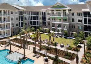 looking down on the grounds of the WaterWalk at Shelter Cove with interiors and outdoor living areas by J. Banks Design Group