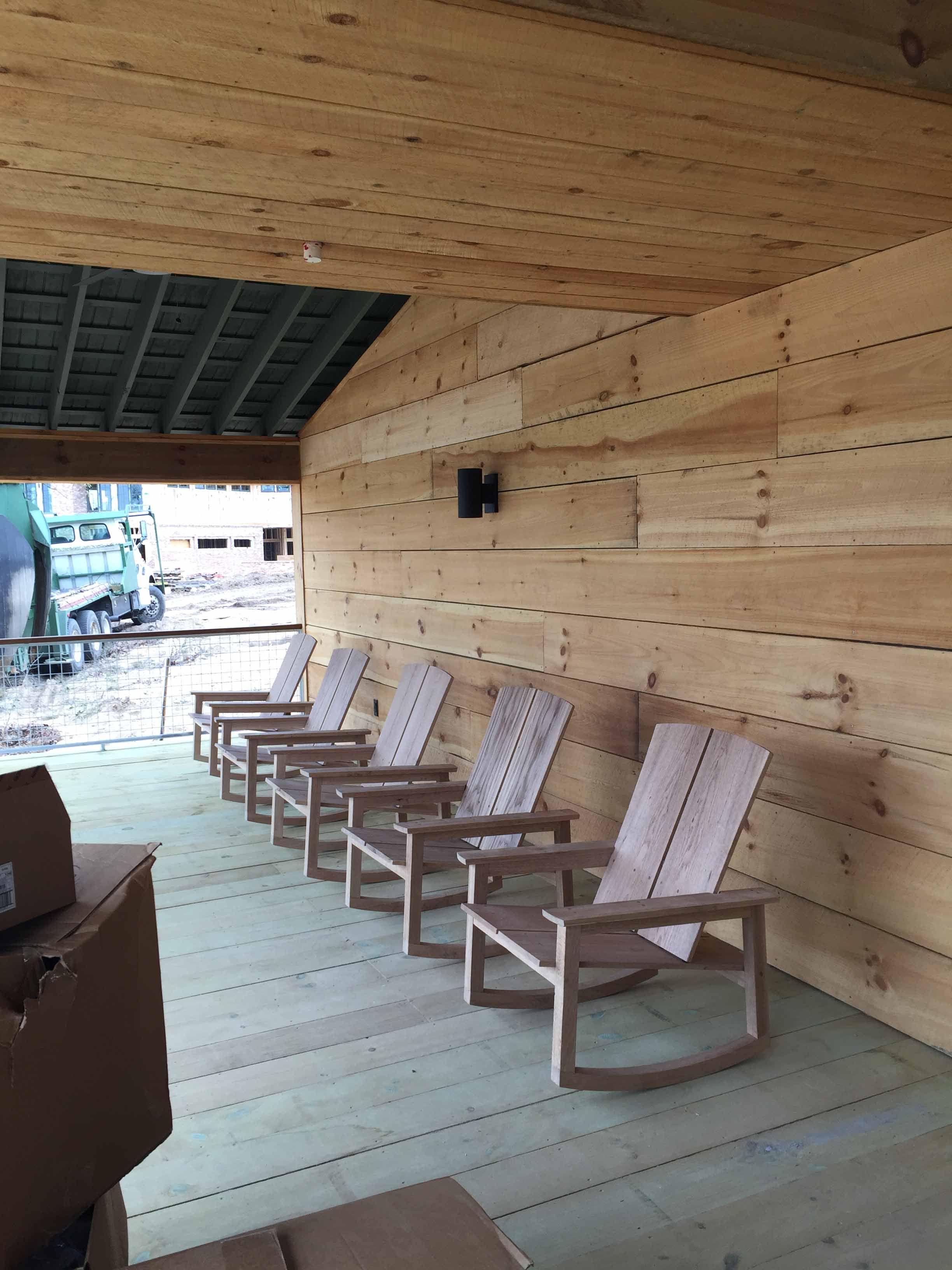 lodge porch furnishings installation at the Ohoopee Match Club resort by j banks design group