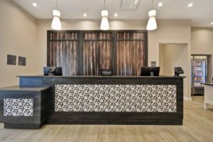 Front Desk at homewood suites illustrates j banks design group's talent at mixing finishes and patterns