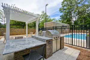 poolside patio grills and arbor that illustrate how hospitality design by j banks design defines fun in the sun luxury