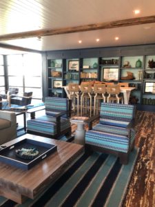 a living area at the timbers on kiawah island designed by the J. Banks Design Group showing patina and bright blues