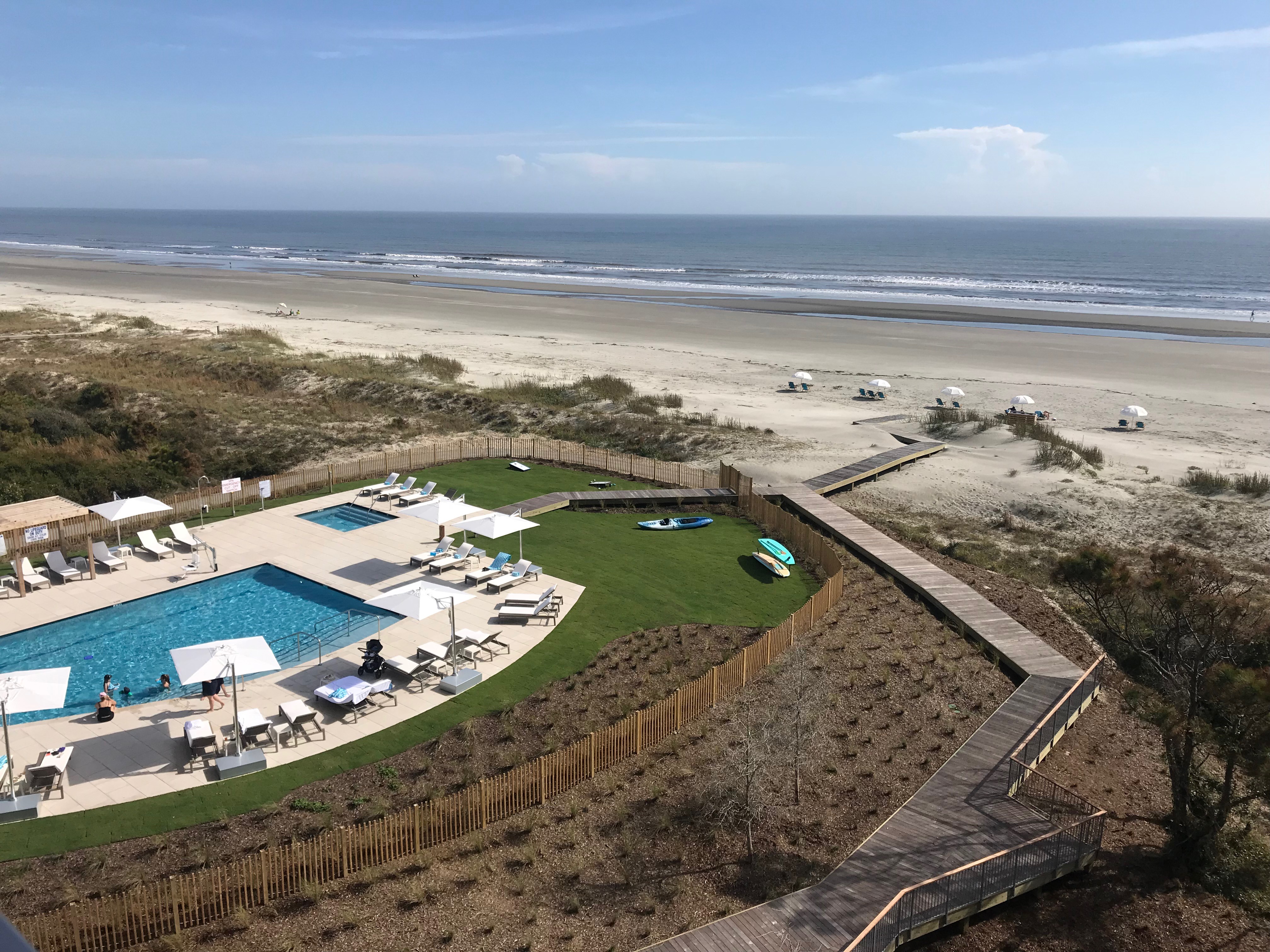 an aerial view of the timbers and beach on kiawah island with interiors designed by the J. Banks Design Group