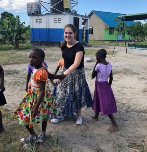 Grace Vanderslice with children from the valentine project children's home in dar es salaam tanzania