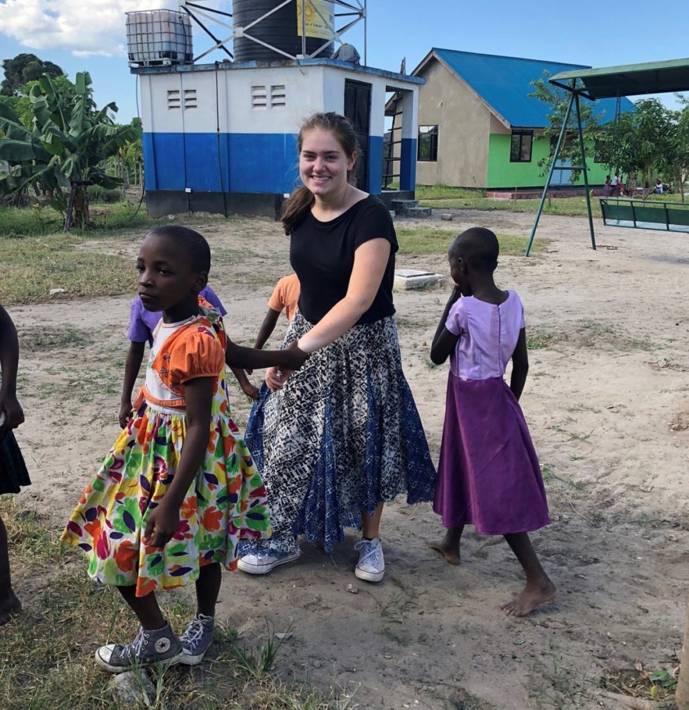 Grace Vanderslice with children from the valentine project children's home in dar es salaam tanzania