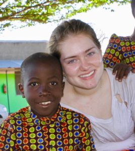 Grace Vanderslice with a child at the valentine project children's home in dar es salaam tanzania