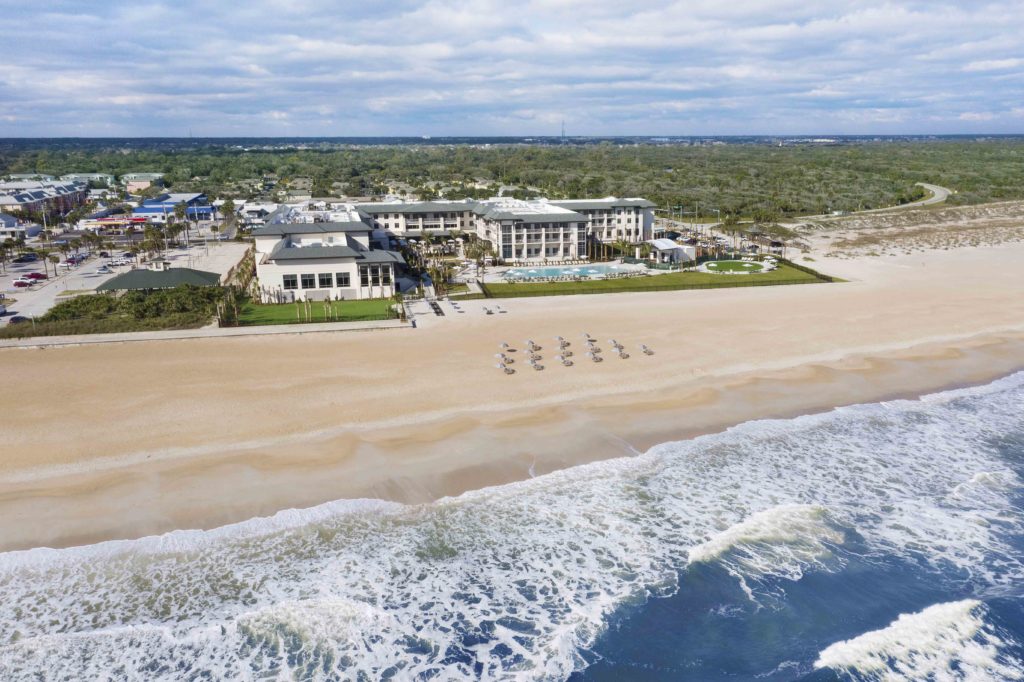 an aerial view of the Embassy Suites in St. Augustine, the interiors and outdoor living spaces designed by the J. Banks Design Group