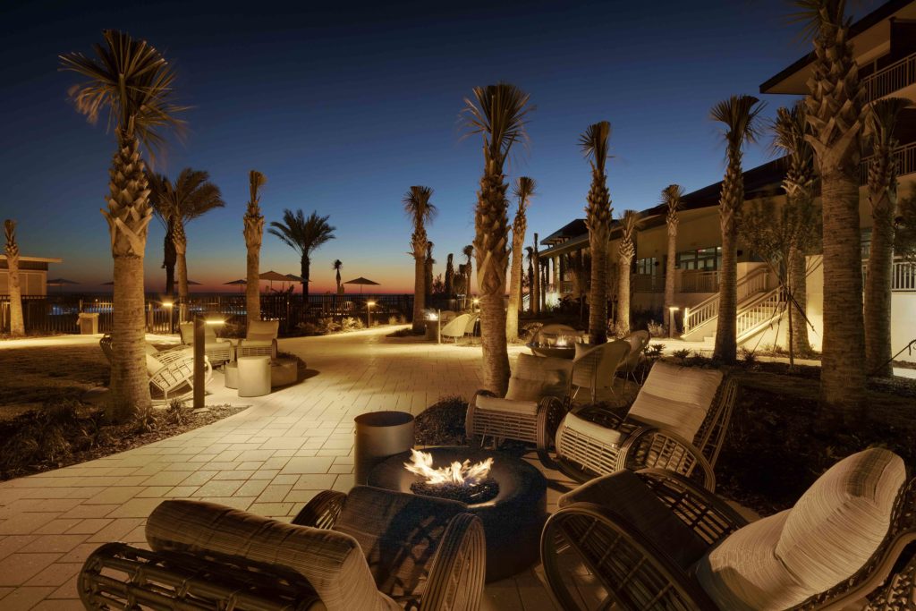 looking toward the ocean from the grounds of the Embassy Suites in St. Augustine, the fire pit and comfortable chaises chosen by the J. Banks Design Group