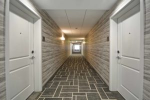 hallway at Homewood Suites in Cary, NC, designed by J Banks Design Group, with mix of patterns and patina