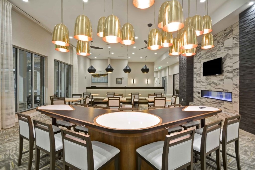 the dining area at Homewood Suites in Cary, NC, designed by J Banks Design Group, with mid-century modern light fixtures