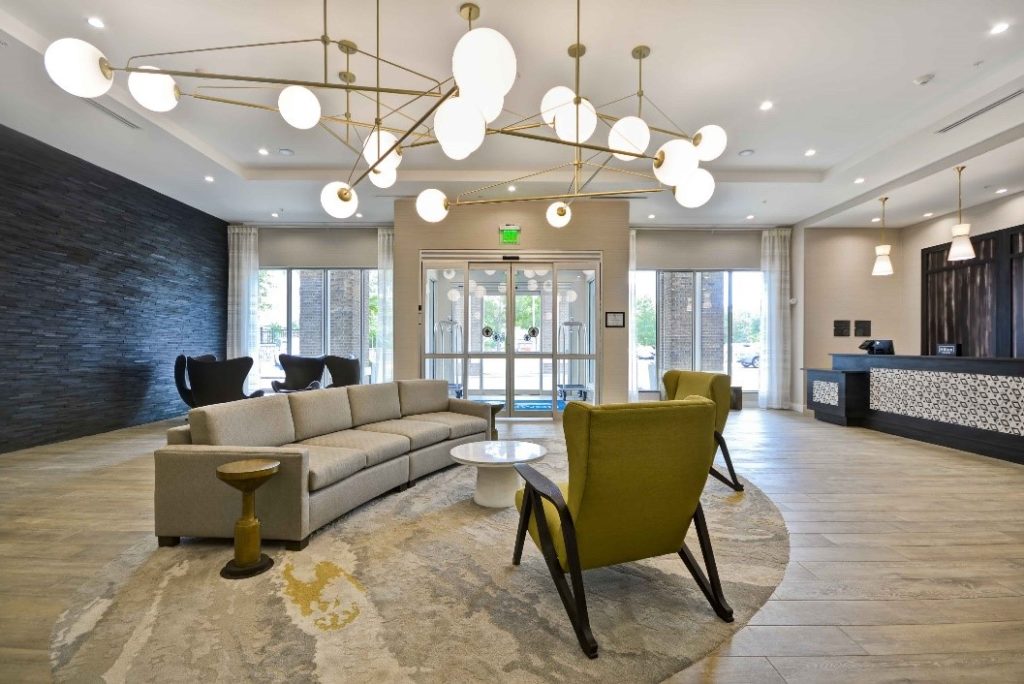 lobby at Homewood Suites in Cary, NC, designed by J Banks Design Group, with mid-century modern light fixtures