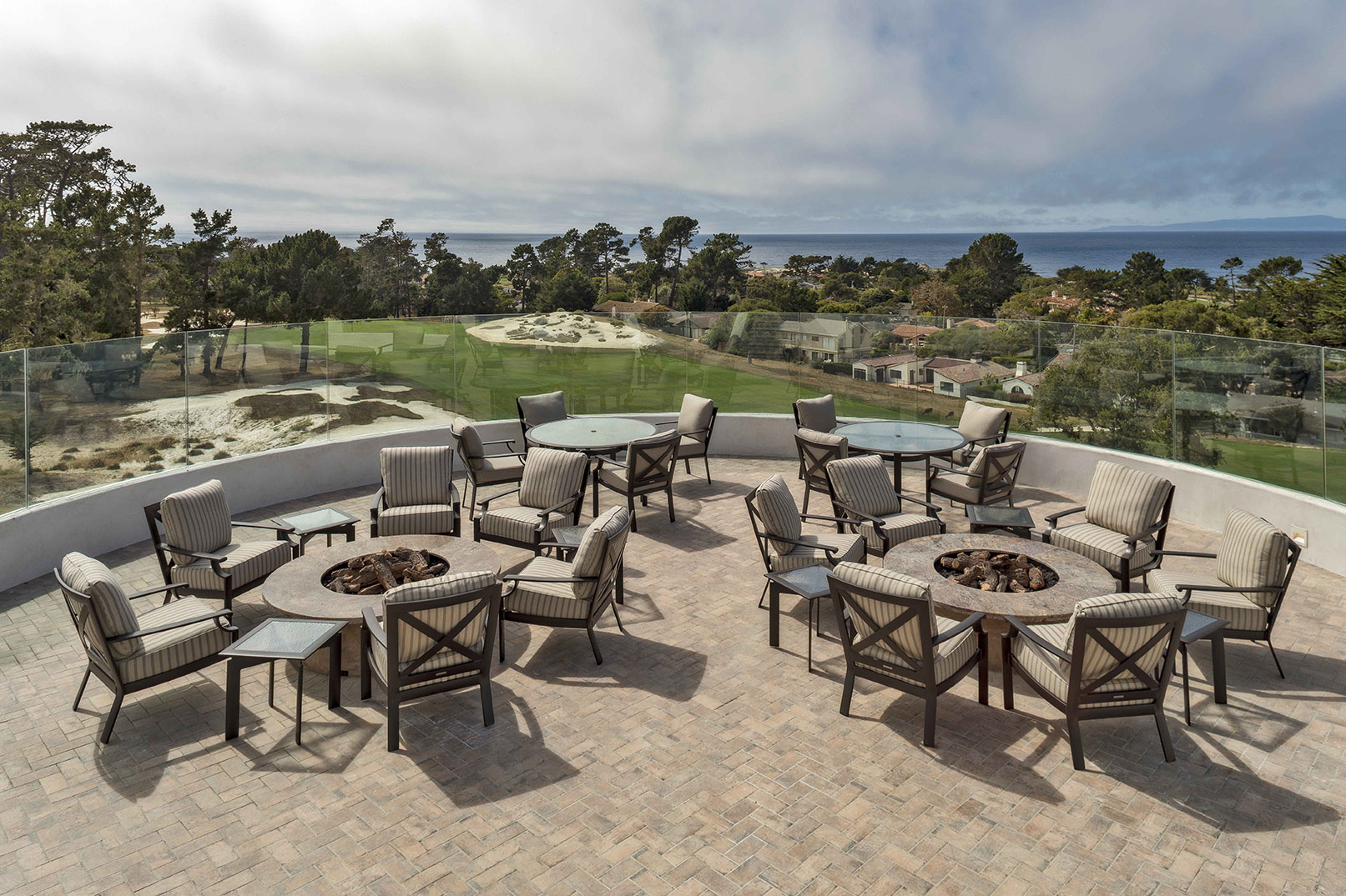 patio setting overlooking the water at Monterey Peninsula Country Club by J Banks Design