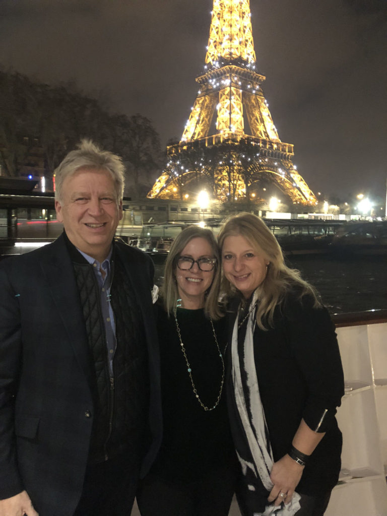 the J Banks Design Group team in front of the Eiffel Tower in Paris for Maison et Objet and Paris Deco Off