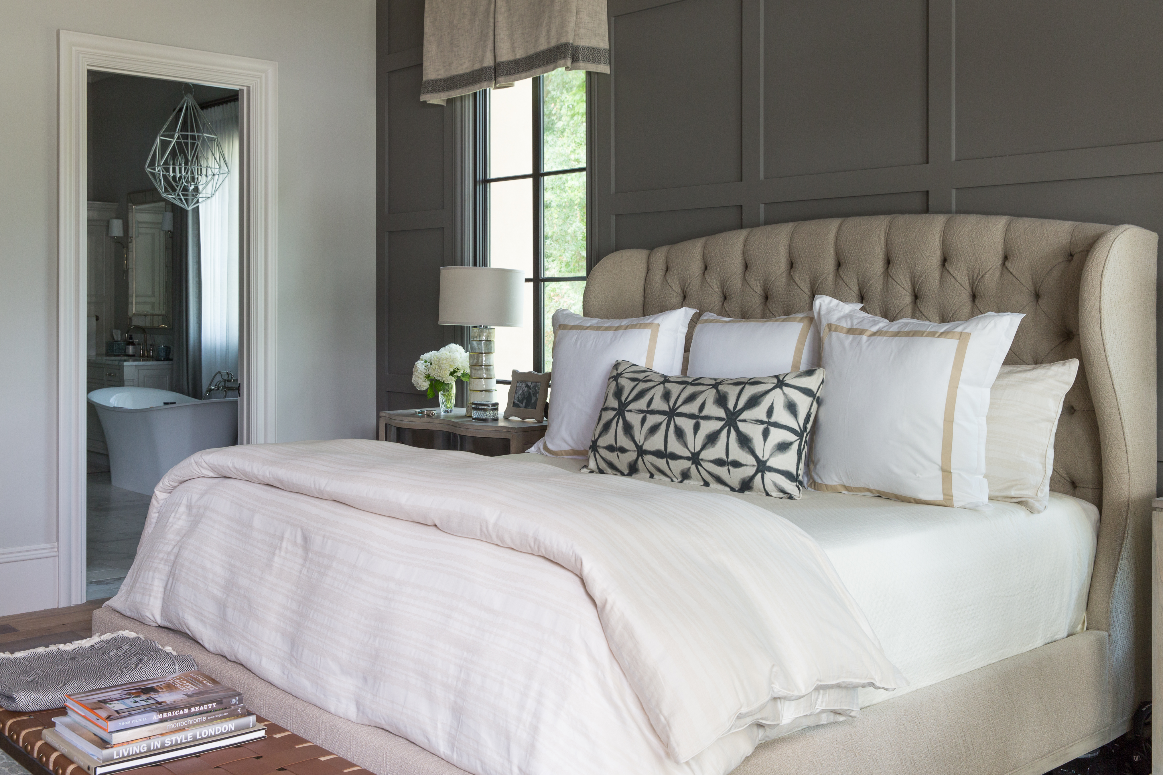 A low country Palmetto Bluff resort guest bedroom with tufted headboards and tons of pillows by J. Banks Design Group