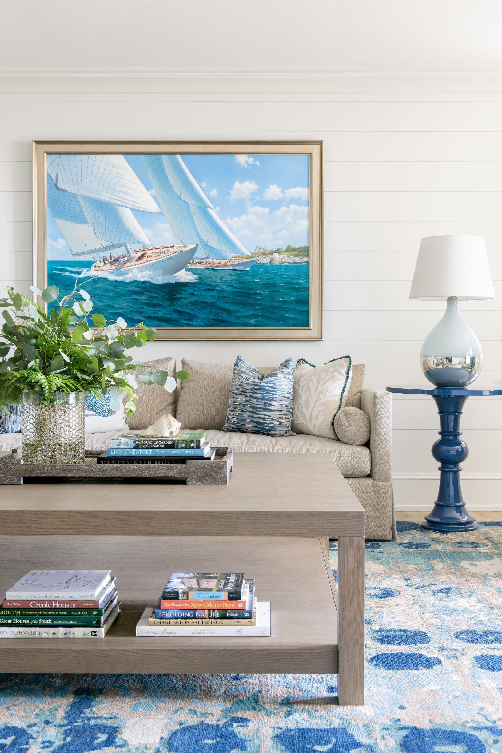 hues of blues & greens drive the design of this coastal living room designed by J. Banks Design Group's Hannah Fulton Toney